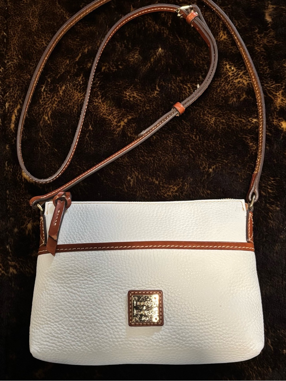 Dooney & Bourke White Pebbled Leather Crossbody with Brown Trim and Gold Plaque
